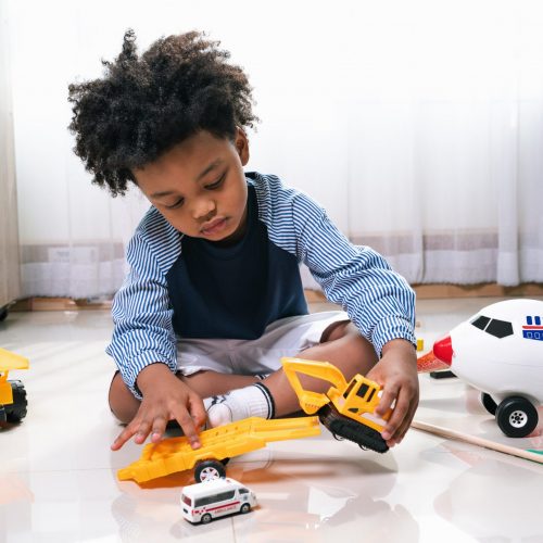 happy-black-people-african-american-child-play-truck-airplane-toy-home