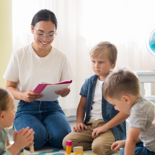 kindergarten-teacher-holding-notebook
